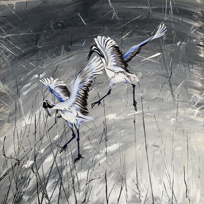 2 White and gray egrets flying on a silver and black background 