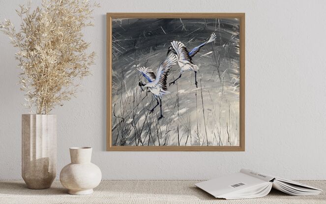 2 White and gray egrets flying on a silver and black background 