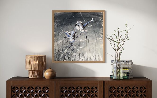 2 White and gray egrets flying on a silver and black background 