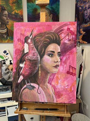 Bright Pink background comes through the artwork powerfully as we enjoy the imagined sounds of the bird perched on the shoulder of a modern woman.