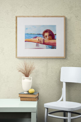 artwork showing a woman resting ontop of her surf board
