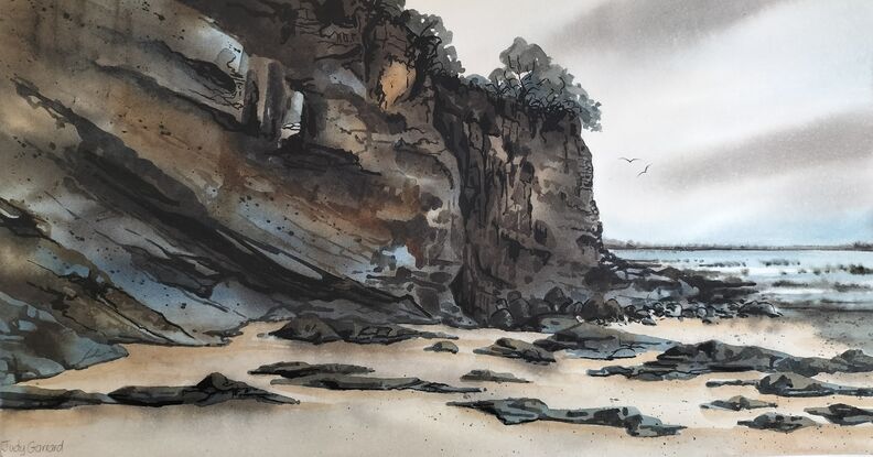 A winter seascape with rocks and cliffs