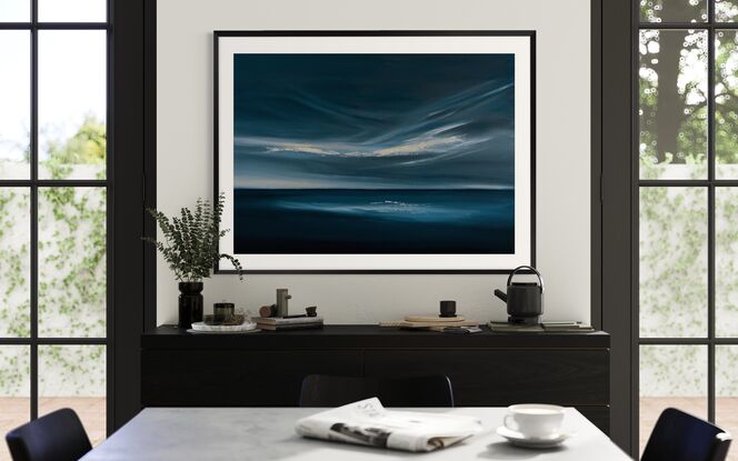 Dark blue ocean and sky with light through clouds and on the horizon. Light reflected on deep blue water. Framed and ready to hang. Modern expressive cloudscape over ocean in deep blue