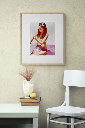 artwork showing a women in a bikini smoothing cream into her skin