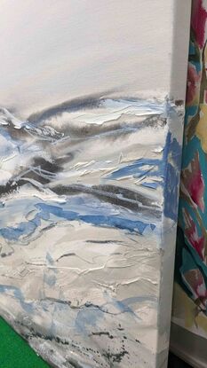 A large abstract artwork painted in shades of light blue, grey and silver depicting the Snowy Mountains.