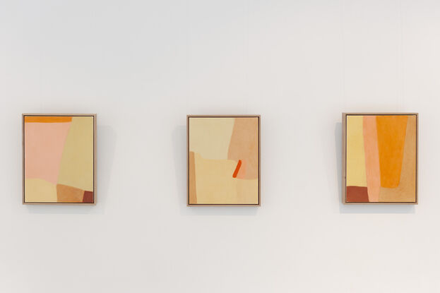 Long abstract shapes run down the canvas in light pink, gold ochre, medium orange and brown ochres, in an abstract composition that lines each colour next to each other.