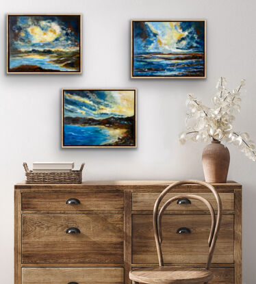 Three Turner styled seascapes at sunset with dramatic clouds and dark rocky outcrops. The skies are warmed by the setting sun and there is encroaching darkness in the clouds. Together these three works celebrate the power of nature. The re is a richness and romantic feeling to these three pieces. There is buttery light that is reflected in the clouds and powerful deep blues in the water that is choppy with the approaching storms.