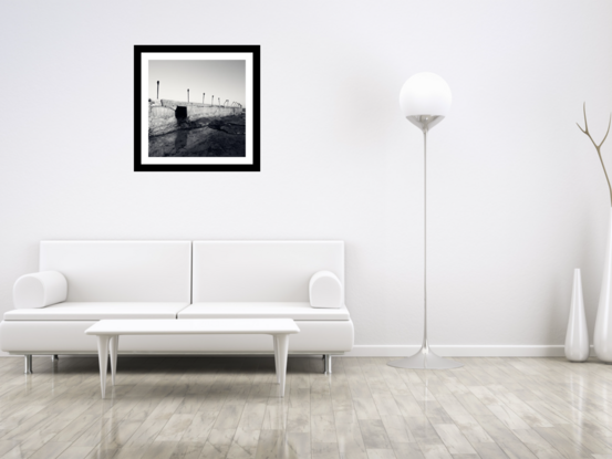 Black framed print of lone ghost gum tree in outback australia.