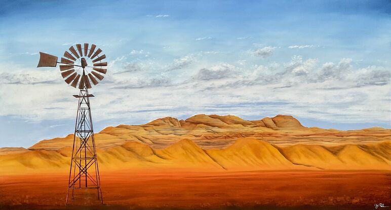 Outback desert mountains and windmill