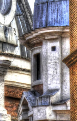 Ancient buildings seen through an alley in Rome, Italy