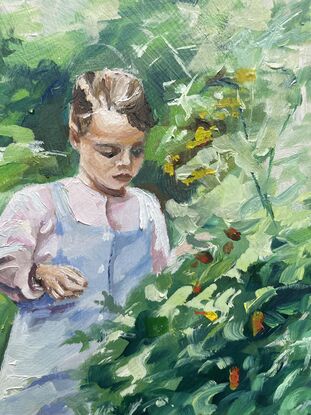 Two young girls walk down a garden path looking closely at the overgrown borders to see if they can find any tomatoes to pick.