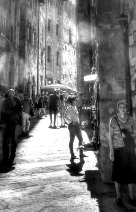 Inviting sunlit street scene in Volterra, Tuscany, Italy