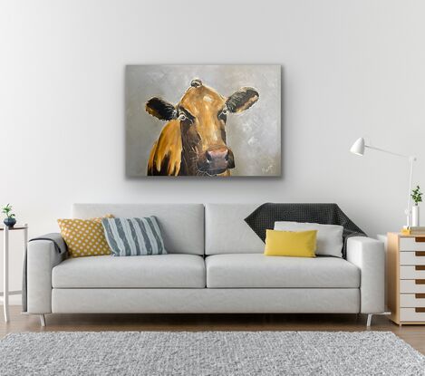 A red brown cow close up  on a sky blue background 