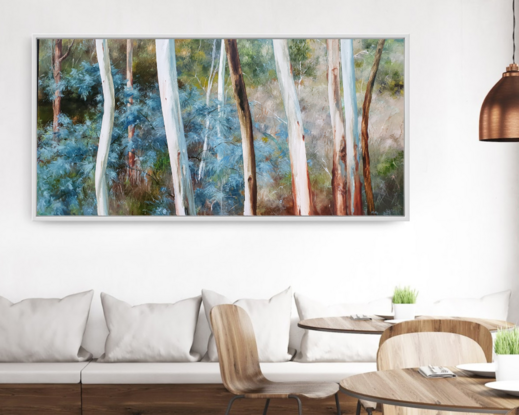 Extra large, long wide landscape painting by Victoria Collins, showing middle-storey of a sapling forest with white gum trees. Features layers of delicate marks from very dark olive green and chocolate brown to ochre, grey-blue and peach and beige tones.