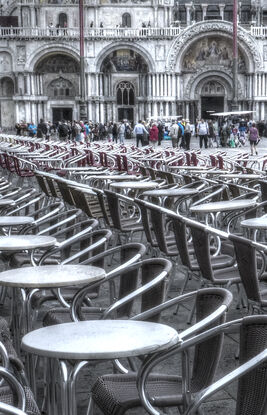 Vacant tables on St Marks Square Venice, Italy