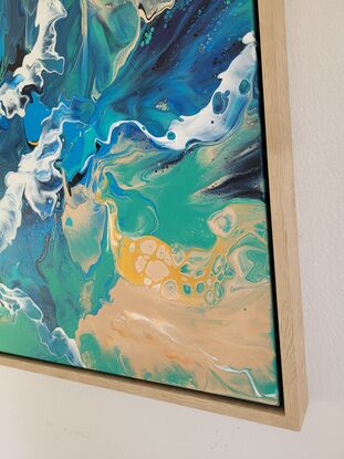 he canvas appears to be a tumultuous sea captured in motion. Layers of rich navy blue mingle with cerulean and turquoise, creating a sense of depth and movement reminiscent of rolling waves. These blues swirls move across the canvas, their fluid forms suggesting the ebb and flow of tides.