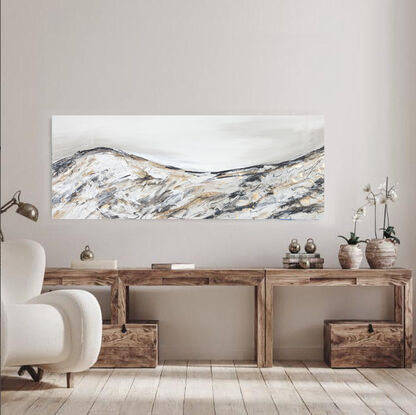 A large abstract landscape painting showing a mountain landscape in shades of cream, black and gold Inspired by the Victorian Alpines Victorian High Country.