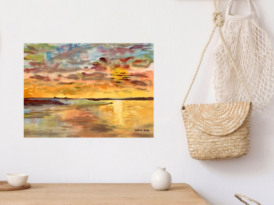 artwork showing a sunset across a stretch of water