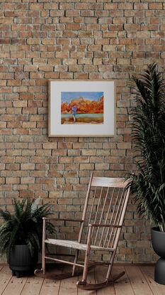 artwork showing a young person taking a photo across a sunlit autumn coloured stretch of water