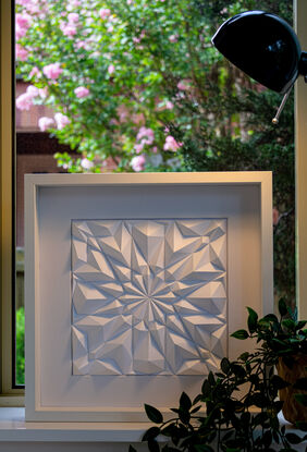 White abstract geometric paper wall art.