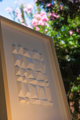 White abstract geometric paper wall art.