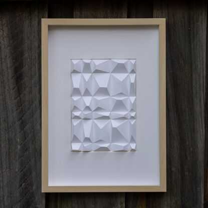 White abstract geometric paper wall art.