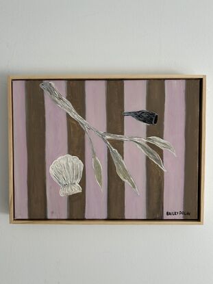 A collection of a shell and small branch with a striped background 