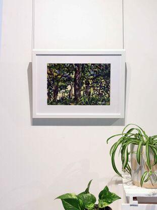 A watercolour painting made in a modern style captures the tonal contrast between deeply shaded foliage and glimpses of the sparkling ocean and beach beyond. The artist made the painting while on location in a method referred to as 'en plein air'. This method grants the painting a fresh and expressive look that suits the subject of a hidden bush track that overlooks an epic surf beach on North Stradbroke Island. Many greens and browns dominate the foreground depicting various types of trees and plants growing in a dense tract of bushland atop Adder Rock, the artist rested here after painting other pieces on location in the area. She was inspired by the unusual sensation of dark foreground and light background and sought to show patches of luminous sand and water through gaps in the greenery.