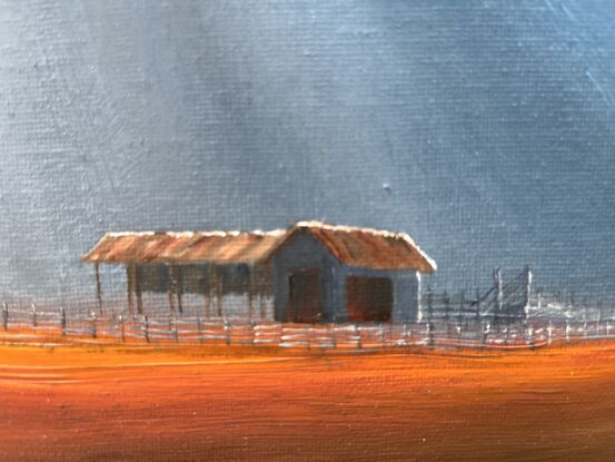 Downpour onto  Aussie outback farm shed and windmill.