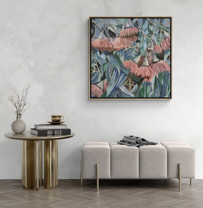 A framed oil painting of pink Australian gum flowers, leaves and blue sky with late afternoon shadows by Amanda Cameron.