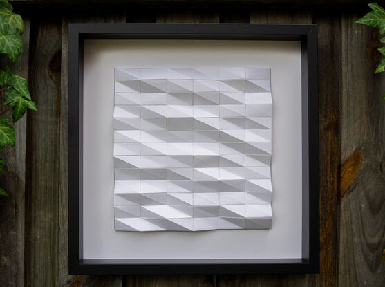 White abstract geometric paper wall art.