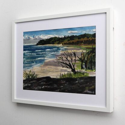 A watercolour painting made in a modern style captures the vastness of a surf beach on North Stradbroke Island, Queensland. The artist made the painting while on location in a method referred to as 'en plein air'. This method grants the painting a fresh and expressive look that suits the subject of wild weather rolling in from the sea. The beach is a beige expanse with lavender shadows falling across it from the large thunderheads above. The wind swept form of a dark skeletal tree in the foreground hints at the danger posed by weather on the island and is formally linked, via shared tonal value, to the mass of stone the artist has depicted in the foreground. This stone implies that she was sitting atop the rock formation as she worked on the piece.