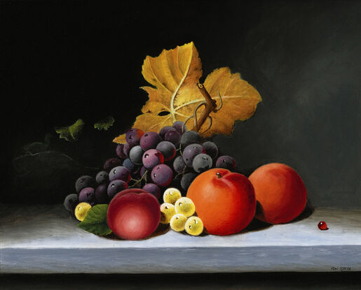 Golden Autumn leaf and fresh fruit on tabletop