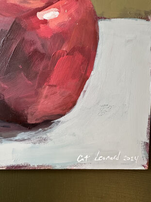 An original, expressive painting of an apple with leaves, painted on board in acrylic paints with visible brush work, ready to hang with chord fastened to the back. 