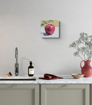 An original, expressive painting of an apple with leaves, painted on board in acrylic paints with visible brush work, ready to hang with chord fastened to the back. 