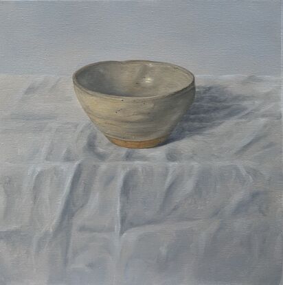 Little pot on a white cloth.