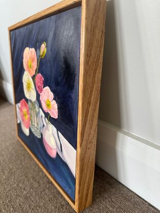 Bight poppies in vases with navy background