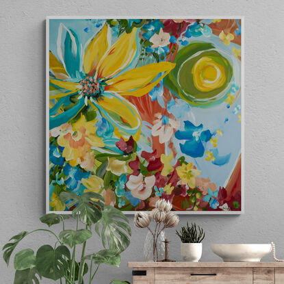 Colourful yellow, red, green, orange and blue abstract flower painting of sunflowers by a window sill with a sun shining through the window. 