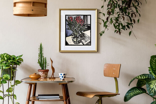 linocut of proteas and book