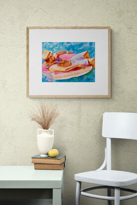 artwork showing a man floating on a lilo in the water
