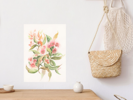 Soft pink gum blossom spray with dancing gum leaves on white background