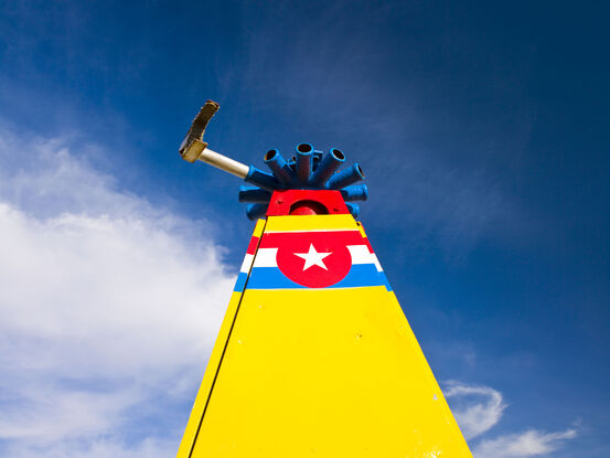 A brightly coloured retired sideshow ride