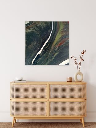 The painting depicts an abstract interpretation of a mountainous landscape as seen from a bird's-eye view. With a river flowing through the center of the canvas,
It was created using the acrylic pouring method with various greens ,sienna and white . this unique technique, allows the acrylic paints to flow and merge organically on the canvas, creating a captivating abstract landscape.