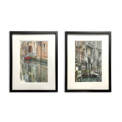 Two artworks of boats on canal in Venice Italy