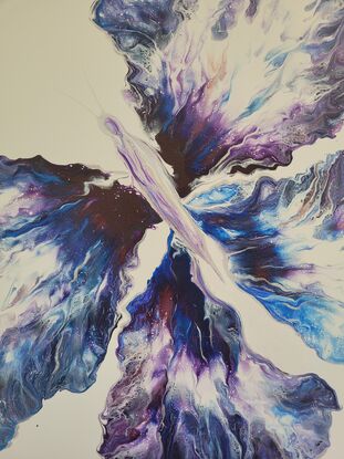 This beautiful vibrant butterfly was created using the acrylic pouring method on a light grey background with various blues purples and silver it truly shines from all angles.
Its four wings spread out as far as they can go over the canvas showing the butterflies true beauty in motion.