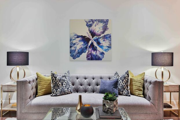 This beautiful vibrant butterfly was created using the acrylic pouring method on a light grey background with various blues purples and silver it truly shines from all angles.
Its four wings spread out as far as they can go over the canvas showing the butterflies true beauty in motion.