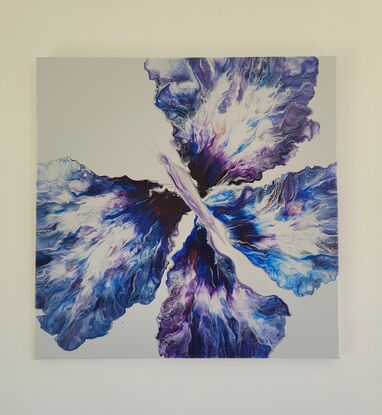 This beautiful vibrant butterfly was created using the acrylic pouring method on a light grey background with various blues purples and silver it truly shines from all angles.
Its four wings spread out as far as they can go over the canvas showing the butterflies true beauty in motion.