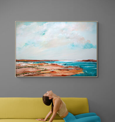 Colourful Abstract seascape in fresh teal green tones with mountain range in the horizon under a dramatic fresh cloudy sky.