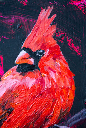 Small painting on wood panel of red cardinal bird perched on a branch with cherry like fruit against a black background