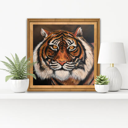 Painted in rich hues this artwork captures the intense gaze of a tiger. This artwork is  unframed 